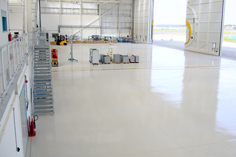 What are the Main Considerations when Selecting a Floor Coating Material for Commercial and Military Aircraft Hangar Facilities?